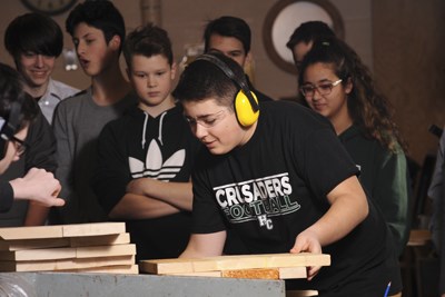 Woodworking students use a jointer.JPG