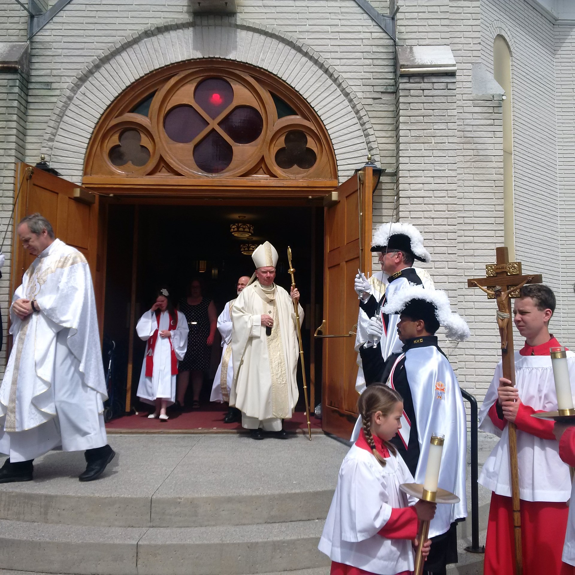 Archbishop walking out of church after mass